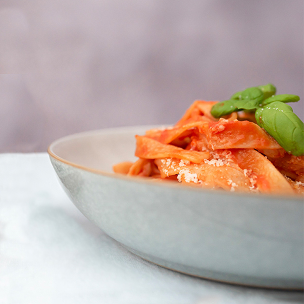 Vegan Organic Basil Pasta Sauce by Seggiano served with tagliatelle and fresh basil.