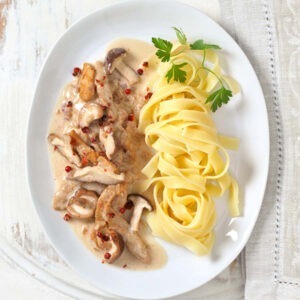 Textured Soya Protein Strips served with creamy sauce, mushrooms and tagliatelle pasta.