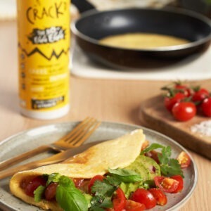 The No-Egg Egg vegan replacer by Crackd served in a vegan omelette with plum tomatoes, fresh herbs and avocado.