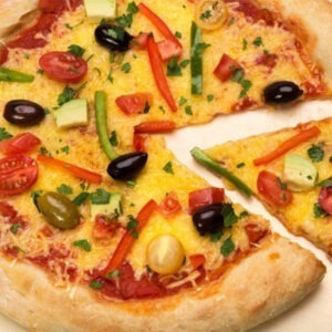 Vegan For Pizza Cheese Alternative Block by Greenvie served melted onto pizza with olives, tomatoes and peppers.