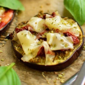 Vegan Mozzarella Cheese Alternative Block by Greenvie served melted on grilled aubergine with sundried tomatoes.