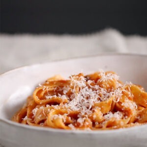 Vegan Arrabbiata Pasta Sauce by Seggiano served with pasta and vegan parmesan cheese alternative.