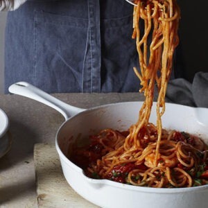 Vegan Marinara Pasta Sauce by Seggiano served with spaghetti, fresh tomatoes and basil.