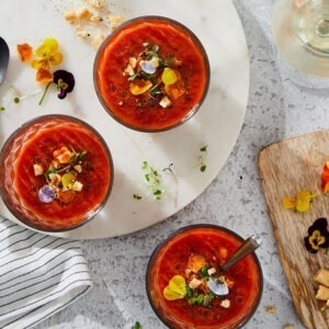 Sicilian Cherry Tomato Salsa by Seggiano served in Bloody Mary cocktails with floral decoration.