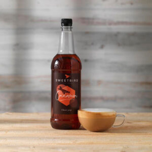 Vegan Cinnamon Classic Syrup by Sweetbird served in a vegan flat white.