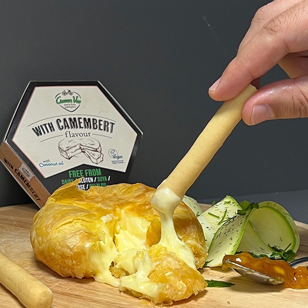 Vegan Camembert Cheese Alternative Block by GreenVie served wrapped in filo pastry and baked, with chutney and breadsticks.