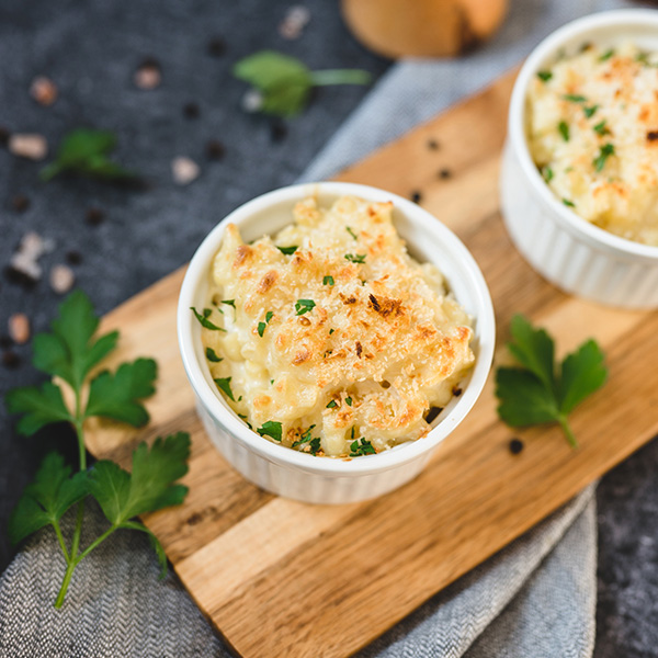 Vegan Grated Smoked Gouda Cheese Alternative by GreenVie served in baked mac and cheese.