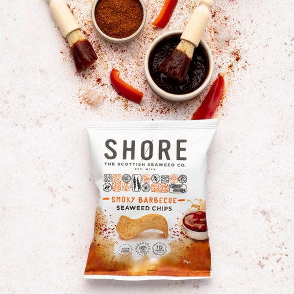 Vegan Smoky Barbecue Seaweed Chips by Shore shown with red pepper slices, barbecue sauce, and spices.